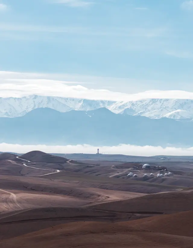 The stone desert of Agafay under the snowy Atlas